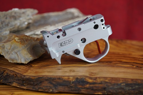 Kidd silver two stage trigger with red curved blade and silver extended (medium) magazine release lever 